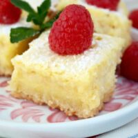 Lemon Bars gluten free recipe with a fresh raspberry on top