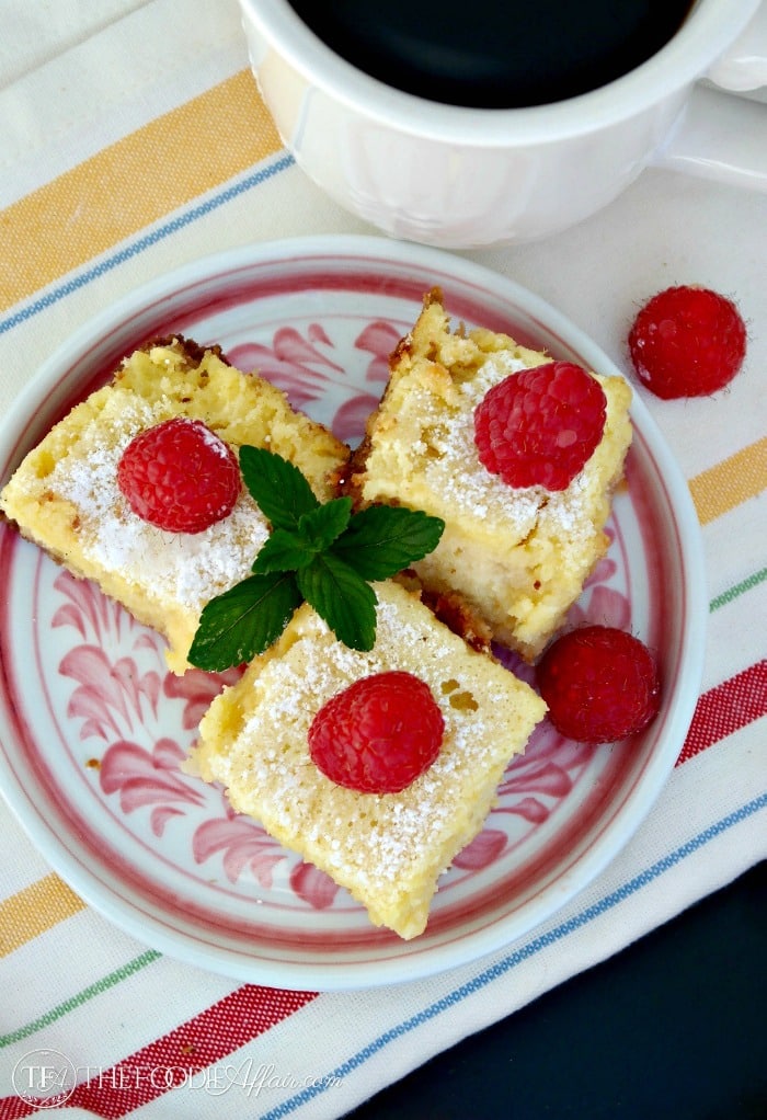 low carb and gluten free lemon bars topped with raspberries