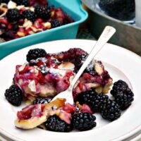 Fruit Breakfast Casserole on a white plate ready to eat