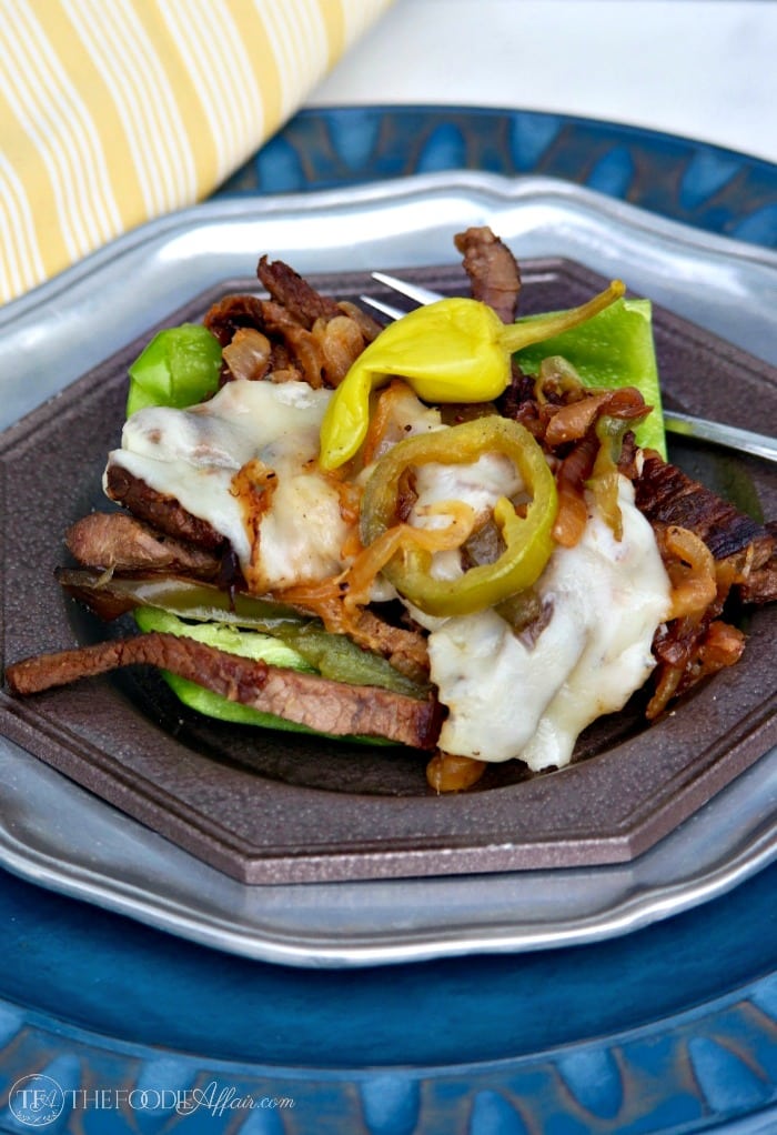 Low Carb Cheese Steak Sandwich melt Philly-style with beef, grilled onions, and melted cheese! Elevate the flavor with jalapeno peppers and peperoncinis!
