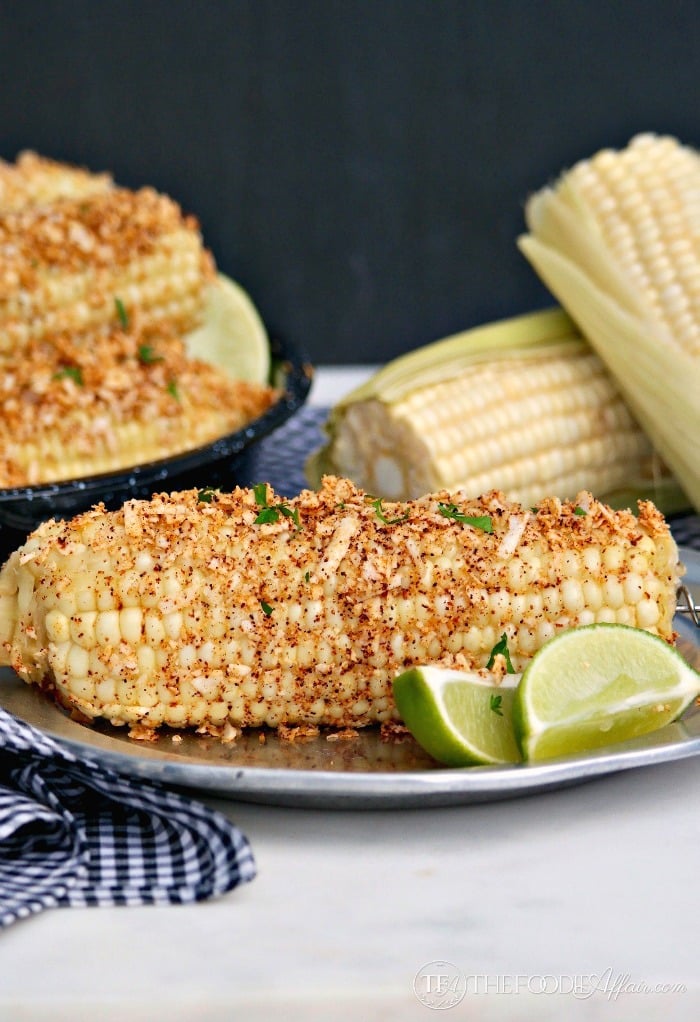 Easy Mexican Style Corn on the Cob topped with plenty of melted butter, chili powder, cotija cheese, salt and fresh lime juice. 