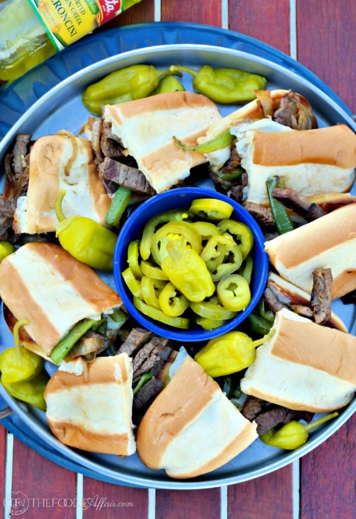 Cheese Steak Sandwich traditional Philly-style with beef, grilled onions, and melted cheese! Elevate the flavor with jalapeno peppers and peperoncinis!