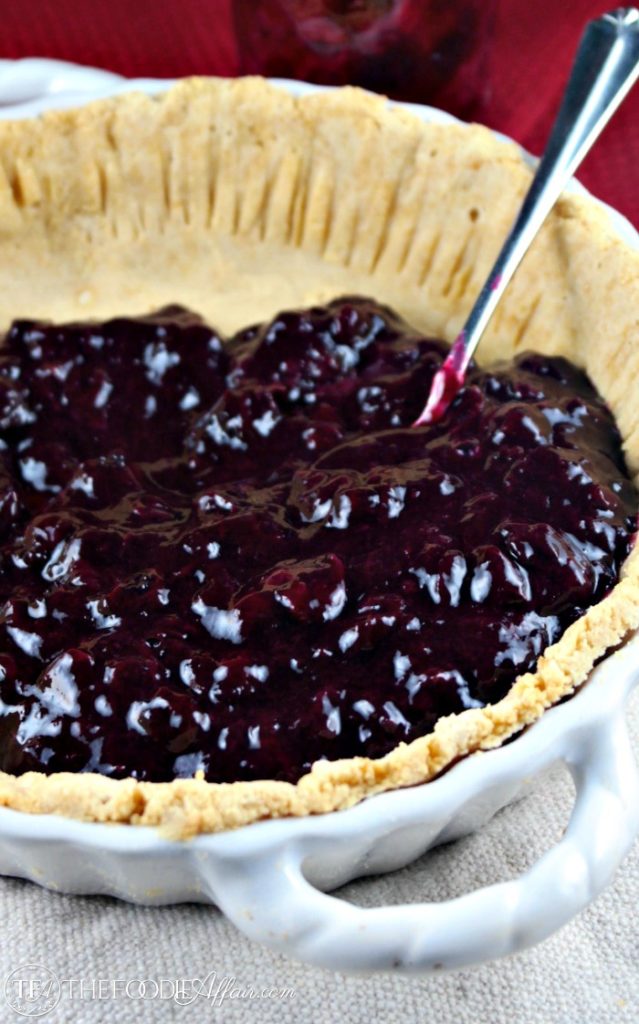 Berry sauce in a coconut flour pie crust 