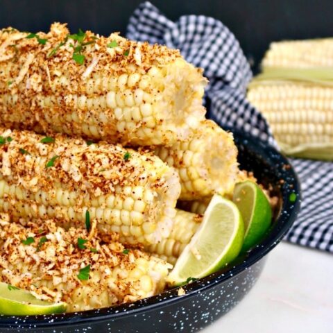 Easy Mexican Style Corn on the Cob topped with plenty of melted butter, chili powder, cotija cheese, salt and fresh lime juice.