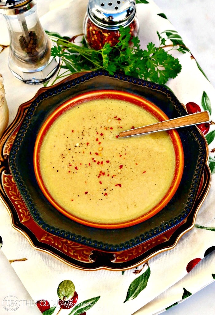 Creamy cauliflower soup with a sprinkle of red peppers