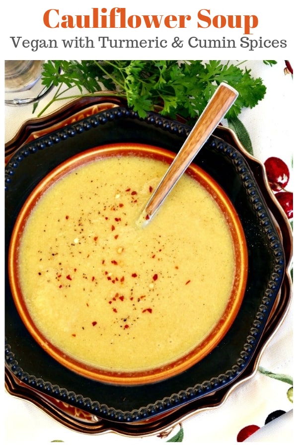 This vegan cauliflower soup will delight your tastebuds with flavorful spices like cumin, turmeric, cardamon with a sprinkle of red pepper to spice it up!  Enjoy this creamy soup as a main meal or add as a starter to your menu! #vegan #soup #cauliflower #dairyfree | www.thefoodieaffair.com