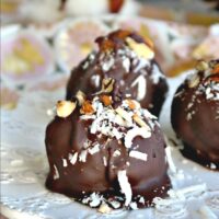 Low carb chocolate covered cookies made with superfine almond flour and coconut flakes #glutenfree #cookies #lowcarb | thefoodieaffair.com