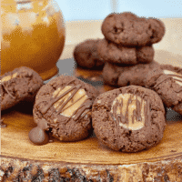 Low carb chocolate thumbprint cookies with a caramel center and sugar free chocolate drizzle #lowcarb #thumbprint #chocolate #cookies | www.thefoodieaffair.com