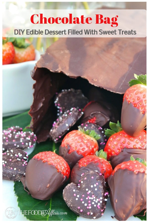 Chocolate bag dessert filled with your favorite treats! This do-it-yourself centerpiece is a stunner, and will be the star of any special occasion! #chocolate #valentinesDay #edible #diy #strawberry #sweet #centerpiece #thefoodieaffair