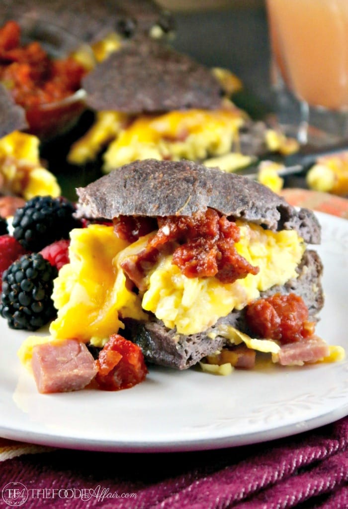 Low Carb Breakfast Sandwich filled with fluffy eggs folded with ham and melted cheese! Serve a crowd or wrap up for a grab and go meal! #breakfast #sandwich #lowcarb #keto | www.thefoodieaffair.com
