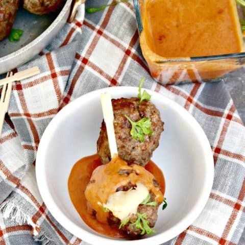 Cheese Stuffed Meatballs with a Creamy Tomato Sauce! Enjoy as an appetizer or serve with pasta #meatballs #cheese #Italian #LCHF | www.thefoodieaffair.com