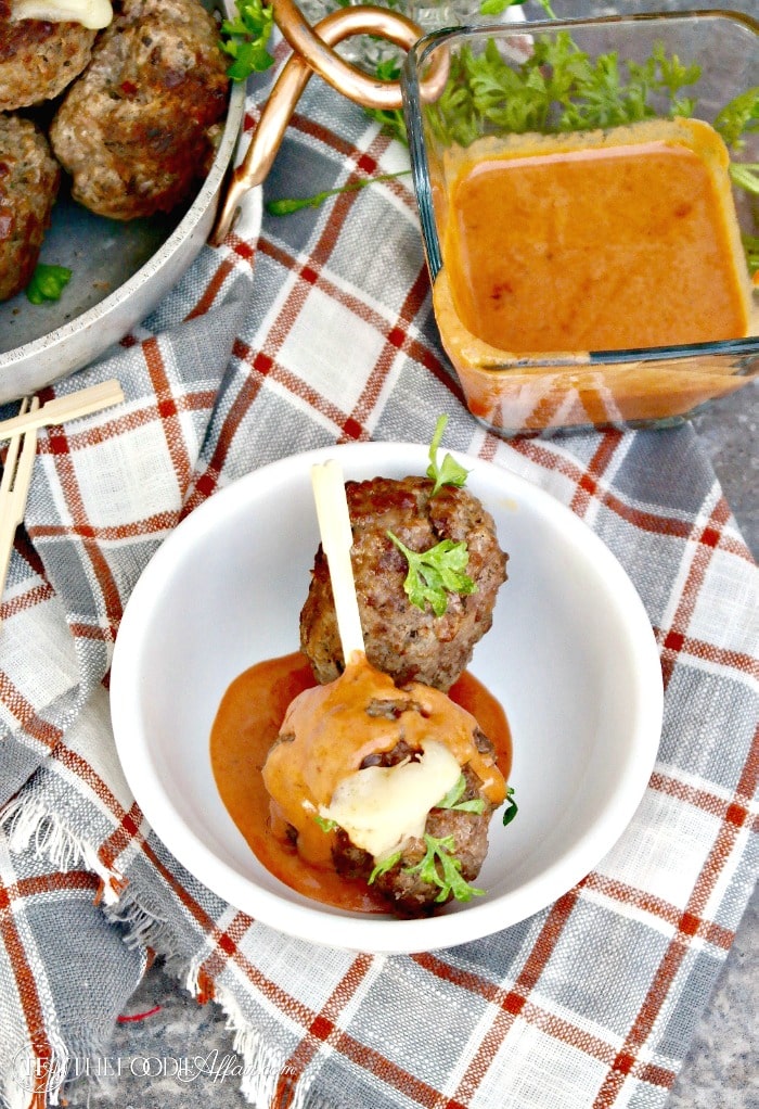 Cheese Stuffed Meatballs with a Creamy Tomato Sauce