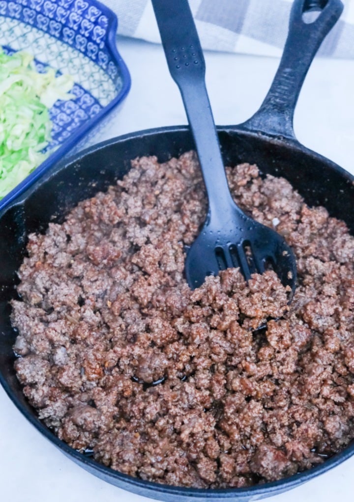 Browning ground beef in a skillet.