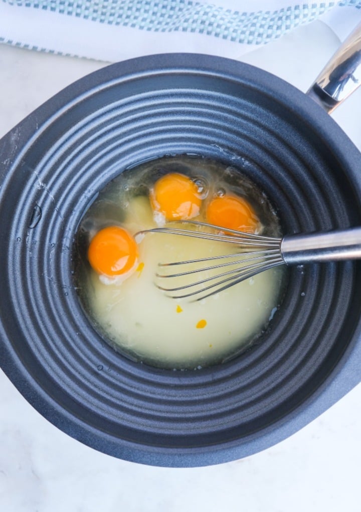 Eggs, sugar and lemon juice in a double boiler ready to whisk. 