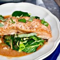 Salmon Coconut Red Curry Sauce over sautéed greens #keto #salmon #coconut | www.thefoodieaffair.com