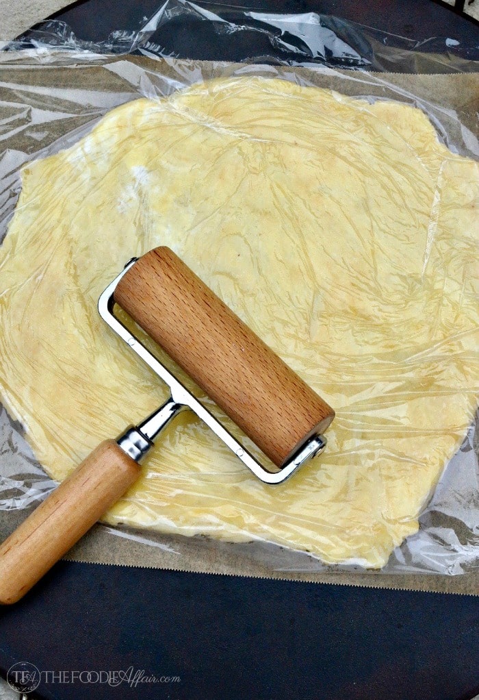 Low Carb Pizza Dough Recipe  rolled with saran wrap on top