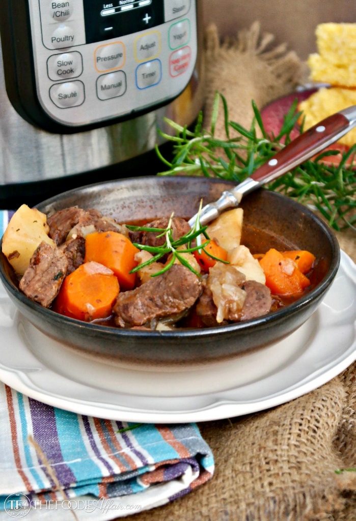 Hearty pressure cooker beef stew in a brown bowl