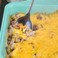 Cheesy mushroom casserole baked in a teal 8 x8 inch pan #Casserole #Vegetarian #Mushrooms | www.thefoodieaffair.com