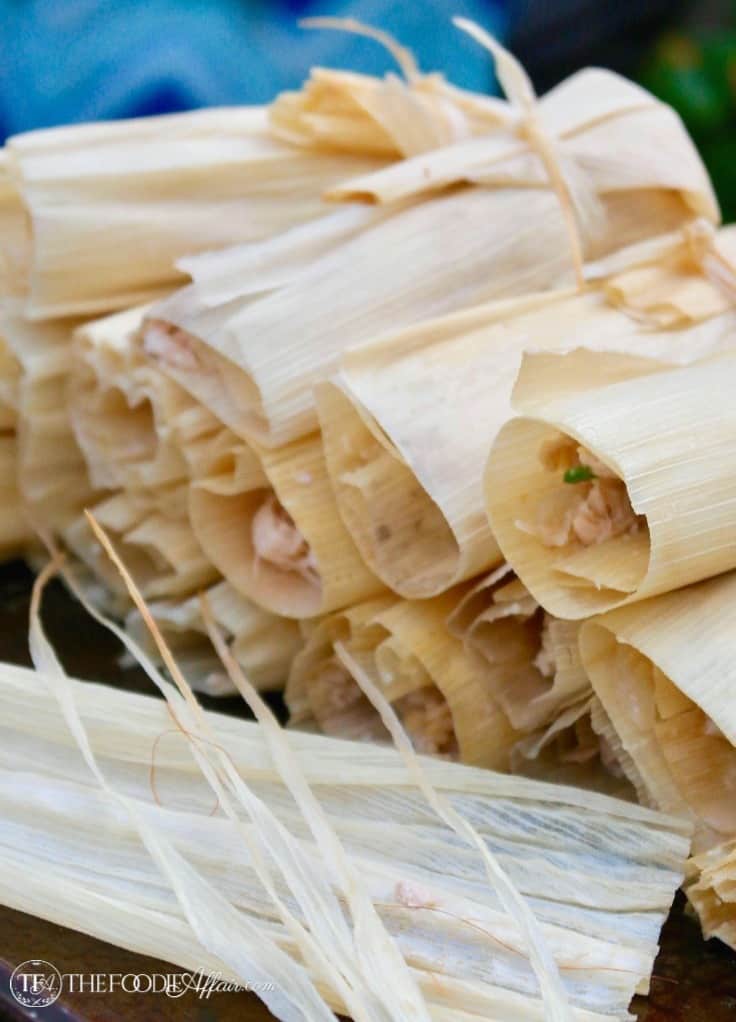 Homemade tamales wrapped in corn husks ready to be steamed #tamales #turkey #recipe | www.thefoodieaffair.com