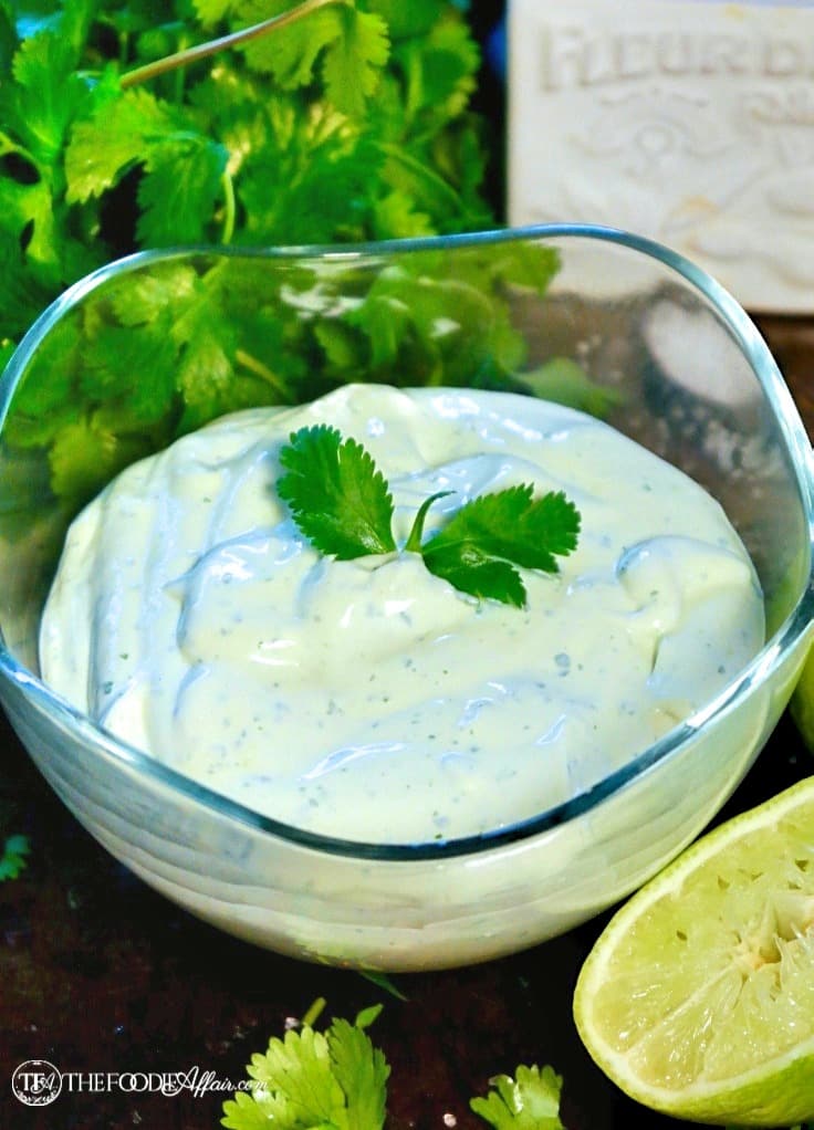 Avocado cream sauce recipe with cilantro in a clear bowl for fish tacos #fishtaco #avocadosauce #dip | www.thefoodieaffair.com