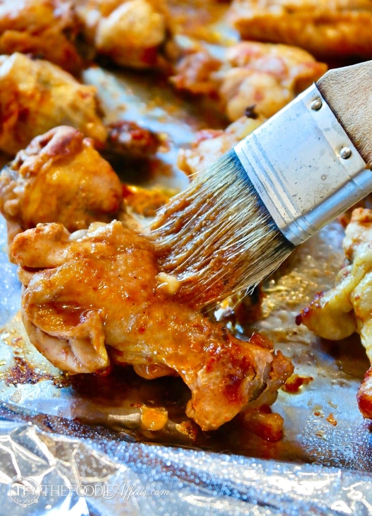 Chicken wings coated with a homemade BBQ sauce broiled after cooking in an Instant Pot.