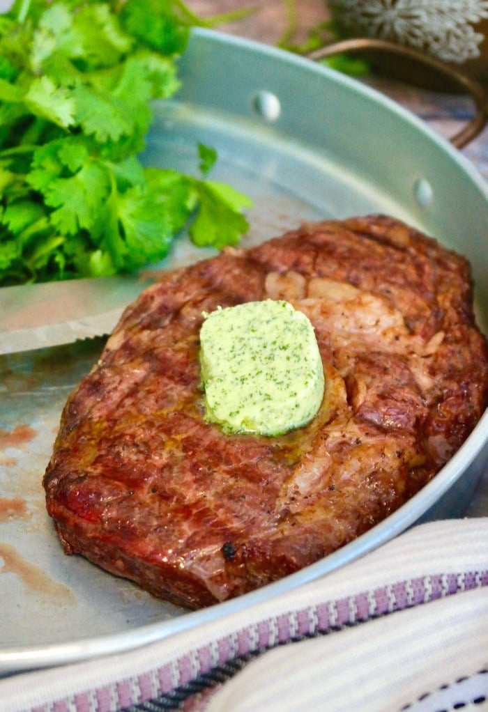 Grilled rib eye steak with butter