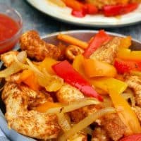 Baked bhicken fajitas in a silver platter