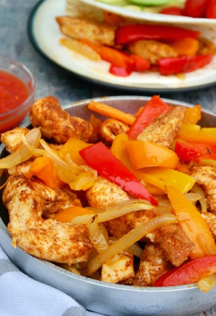 Baked bhicken fajitas in a silver platter