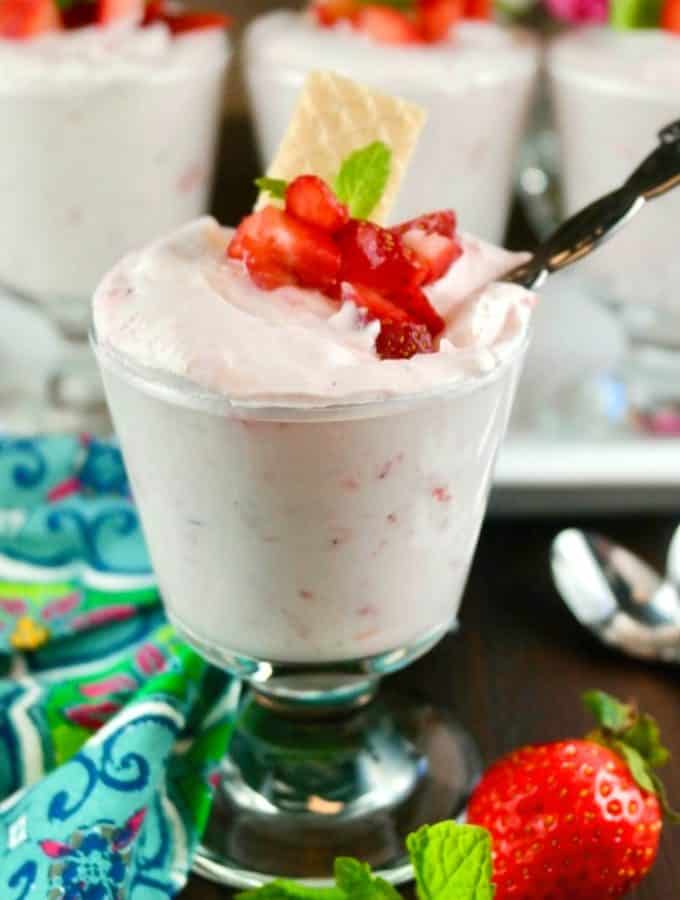 Strawberry mousse in a clear small trifle topped with fresh strawberries