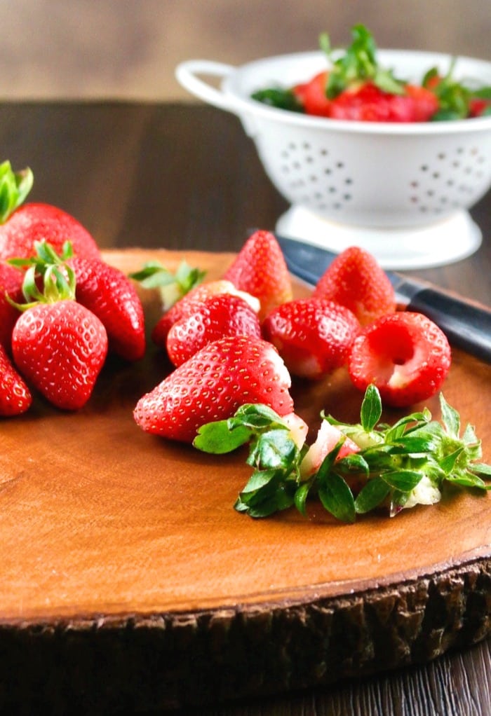 Fresh strawberries on a cutting board to make strawberry puree