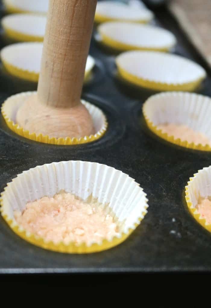 crumbs on the bottom of a cupcake liner for mini cheesecakes