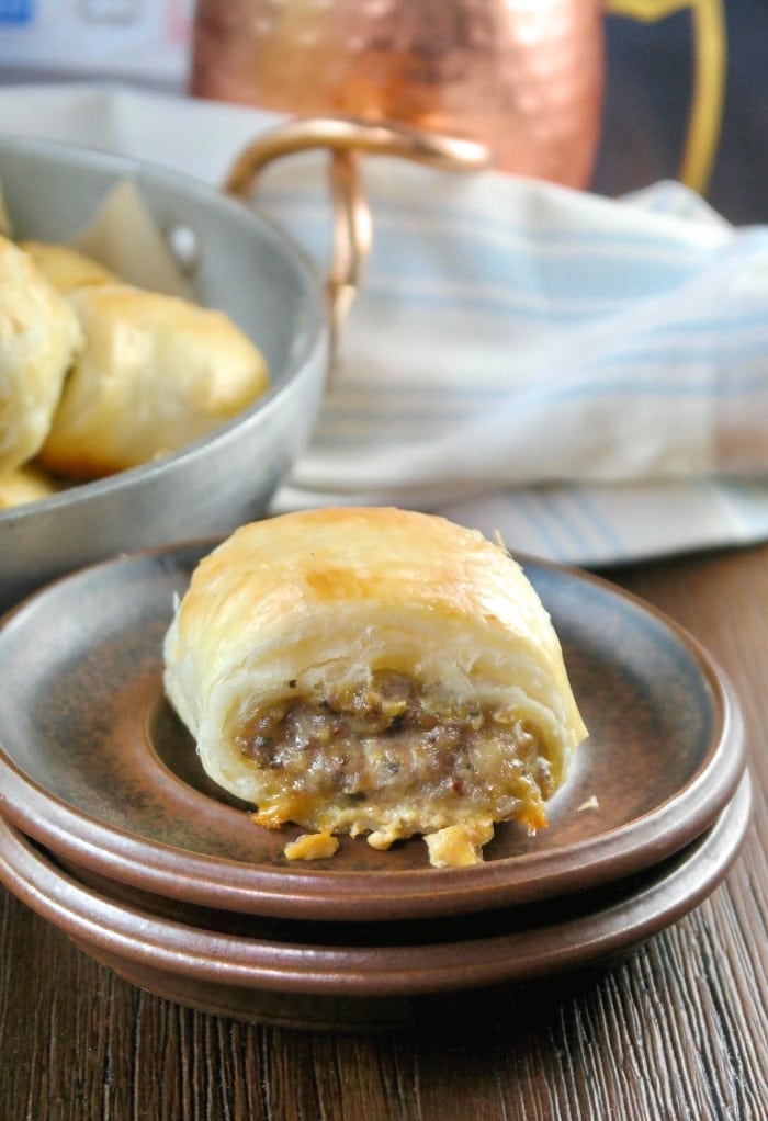 slice of sausage roll on a small brown plate