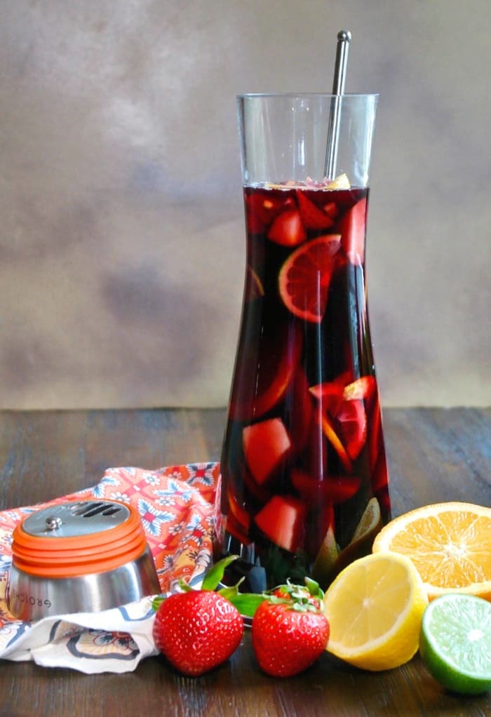 Red wine Spanish sangria in a glass decanter with fresh diced fruit