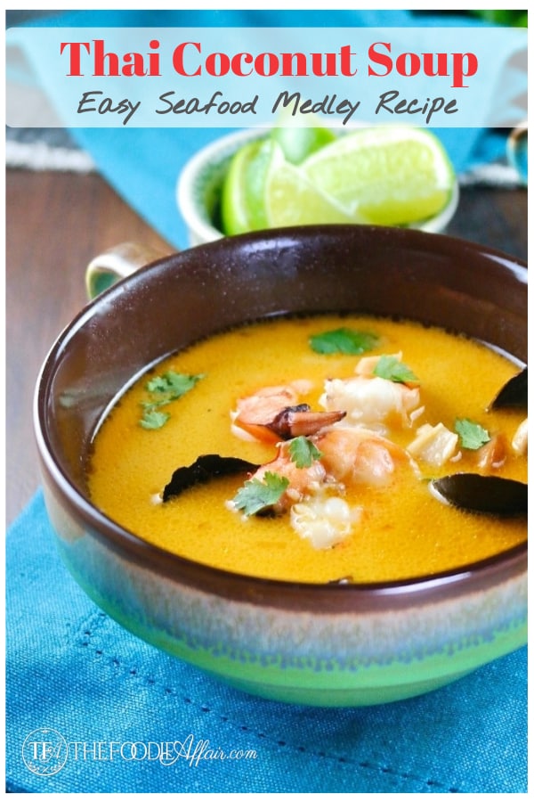 Delicious Thai coconut soup with seafood medley of calamari, shrimp and muscles