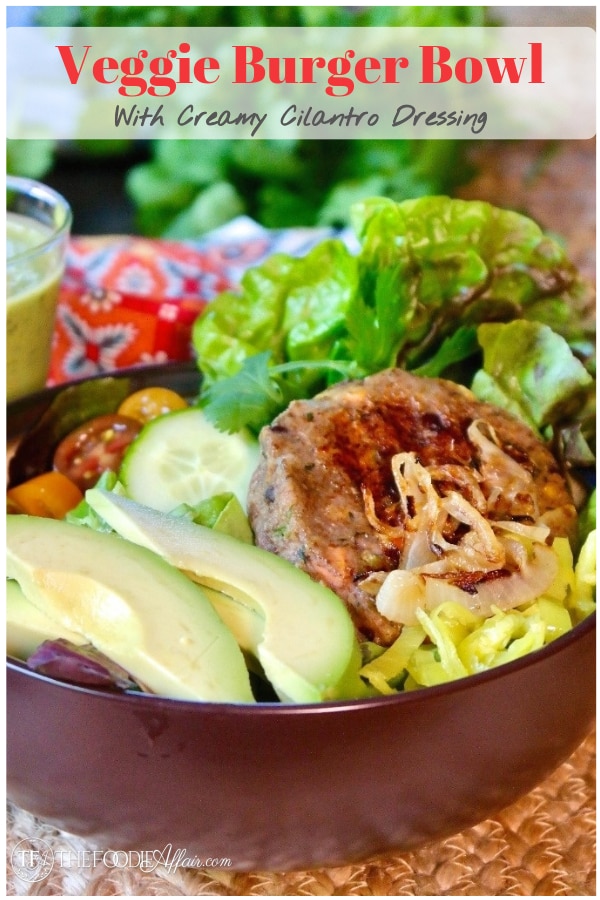 Easy flavorful veggie burger bowl loaded with lettuce, tomatoes, avocado slices, cucumbers and grilled onions topped with a creamy cilantro dressing. #ad #easyrecipe #vegetarian #meatless #latin #bubba #salad #thefoodieaffair