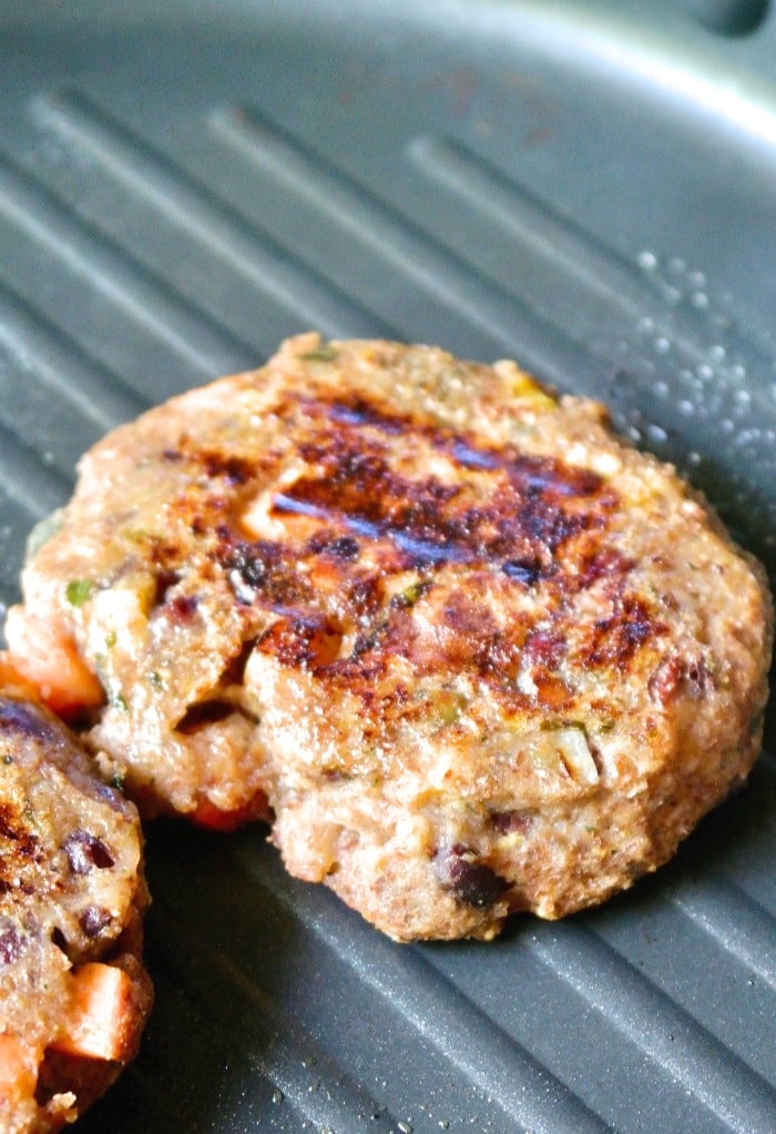 Grilled veggie burger cooking on a pan 