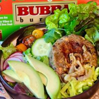 Bubba veggie burger in a brown bowl with salad