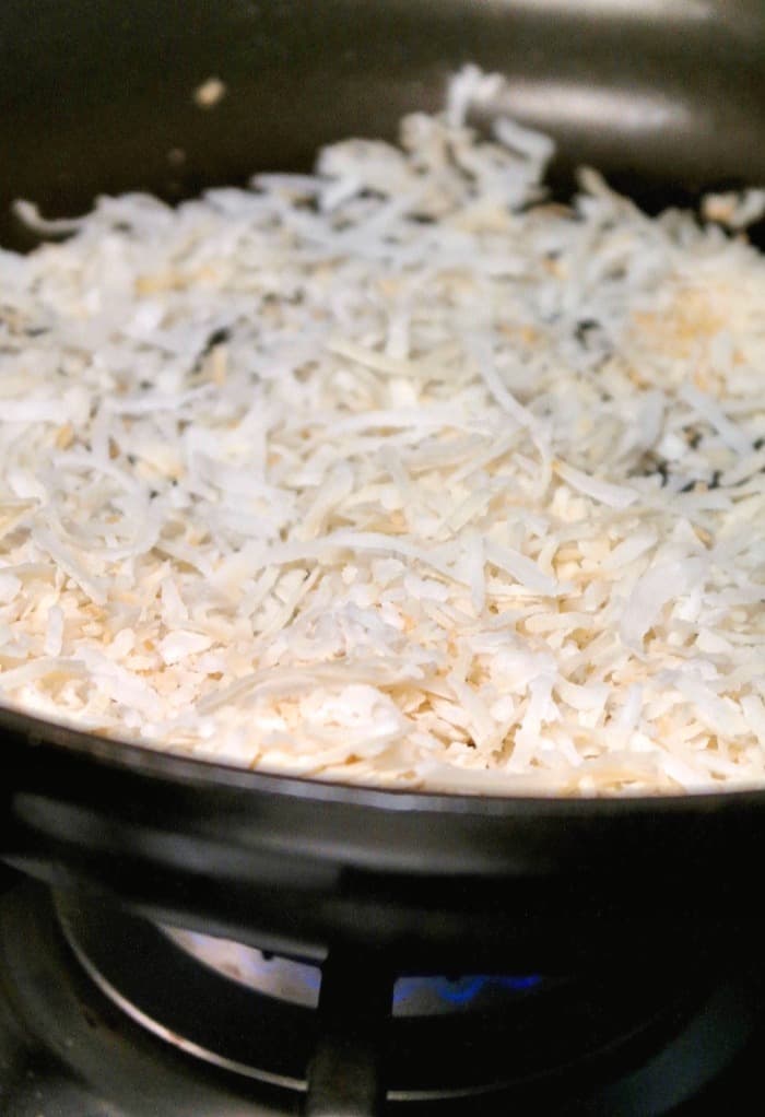 toasted coconut in a skillet 