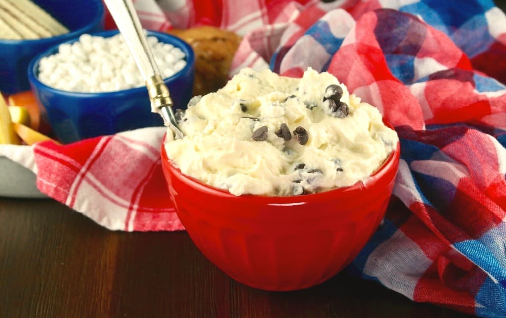 red bowl with chocolate chip dip and serving knife