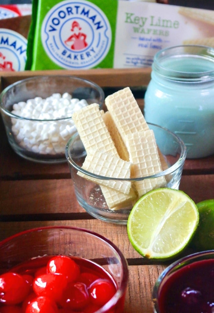 Ice cream bar toppings on a wooden tray