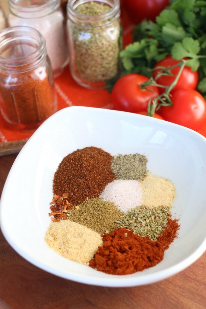 Individual spices in a bowl for taco seasoning recipe.