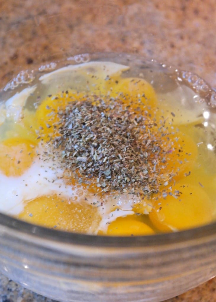 Raw eggs with spices for spinach egg casserole