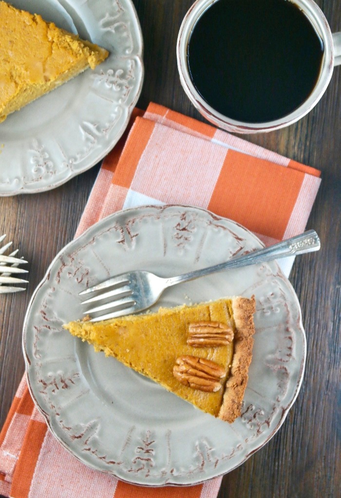 Slice of pie with pecans on top 