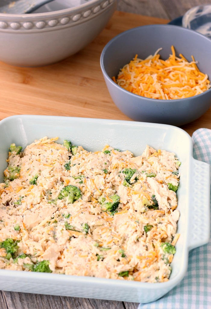 Keto chicken broccoli casserole in a baking dish ready for the oven. 