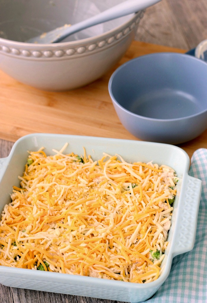 Low carb chicken casserole with broccoli topped with extra cheese ready to be baked. 