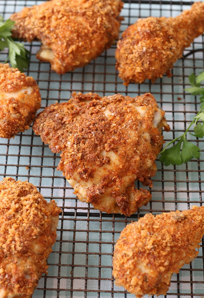 Closer shot of the fried chicken using pork rinds. 