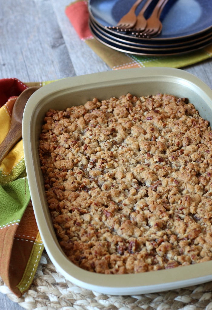 Baked sweet potato casserole ready to be eaten with golden brown topping. 