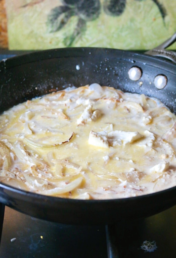 Melted cream cheese in a skillet for sauce in green bean casserole