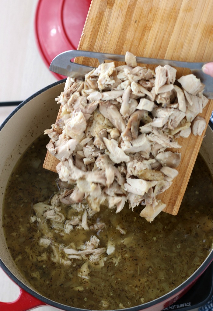 Chopped chicken is added back into the pot before we serve up this delicious chicken soup recipe.