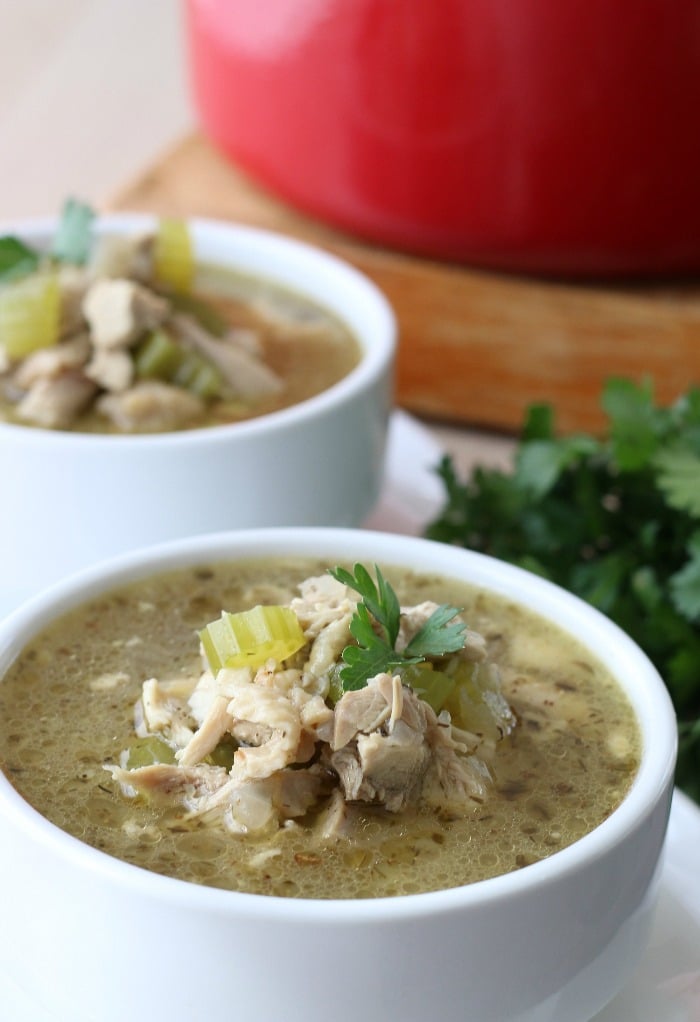 Close up shot of one of the bowls of finished ket chicken soup.